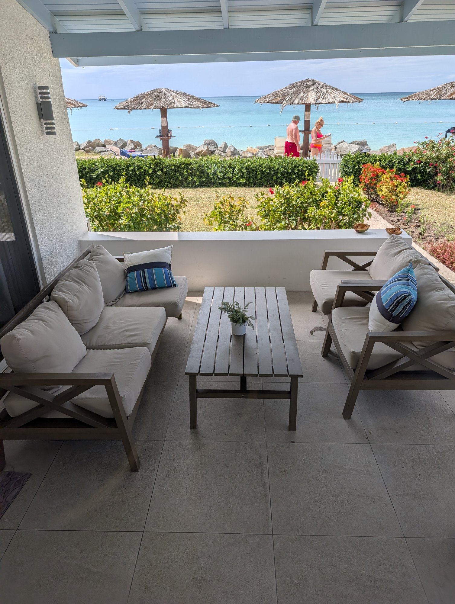 The terrace — the beach starts at the hedge