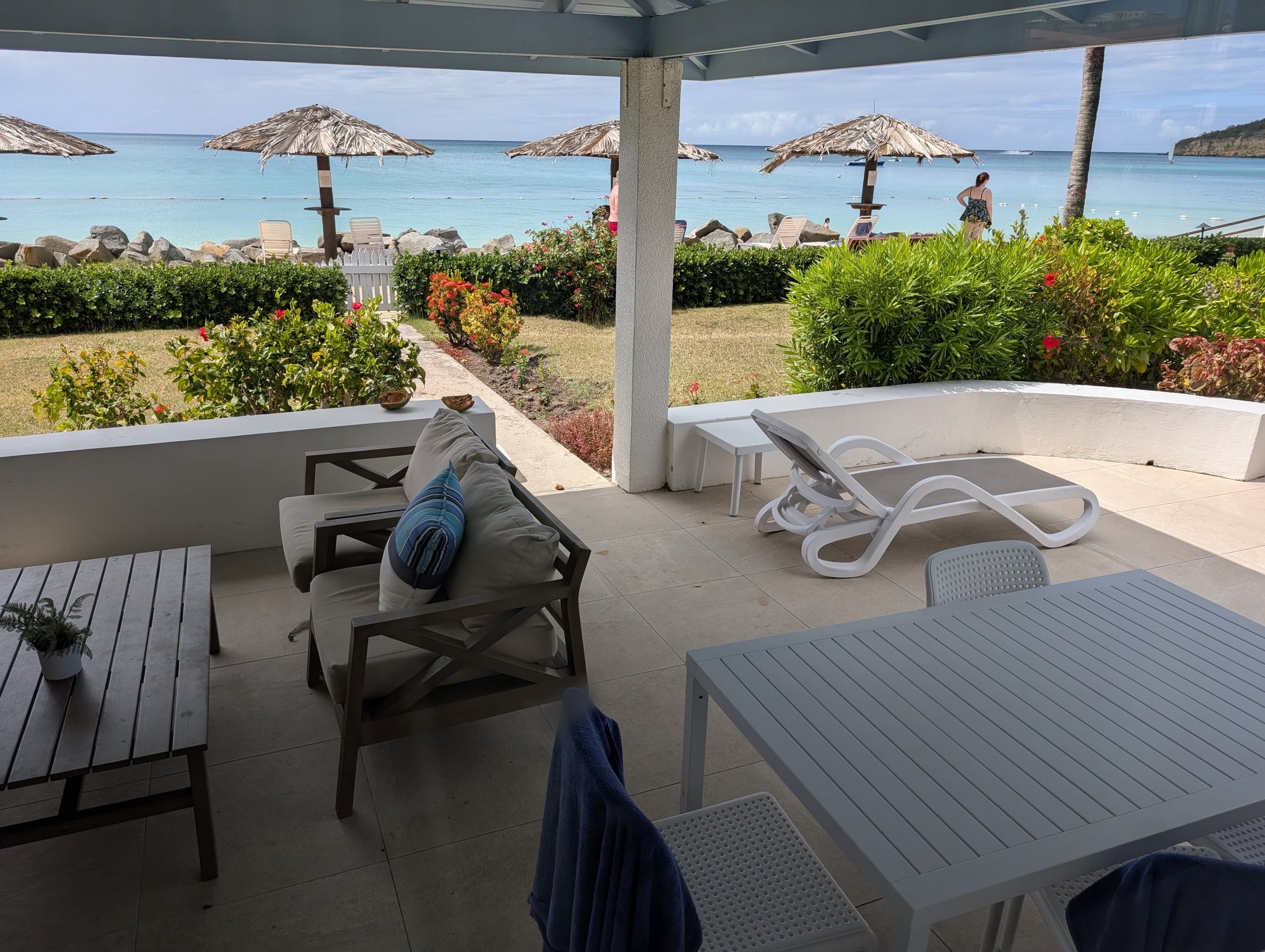 Loungers, a dining table and the sea, all on the terrace
